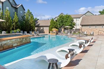 Resort-style pool with aqua sun ledge